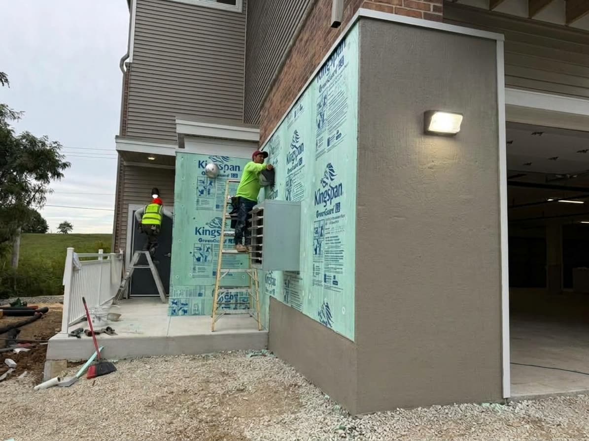 Exterior wall before Insulcrette installation, insulation board exposed